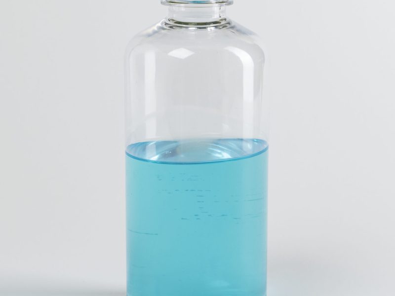 Blue ethanol alcohol bottle